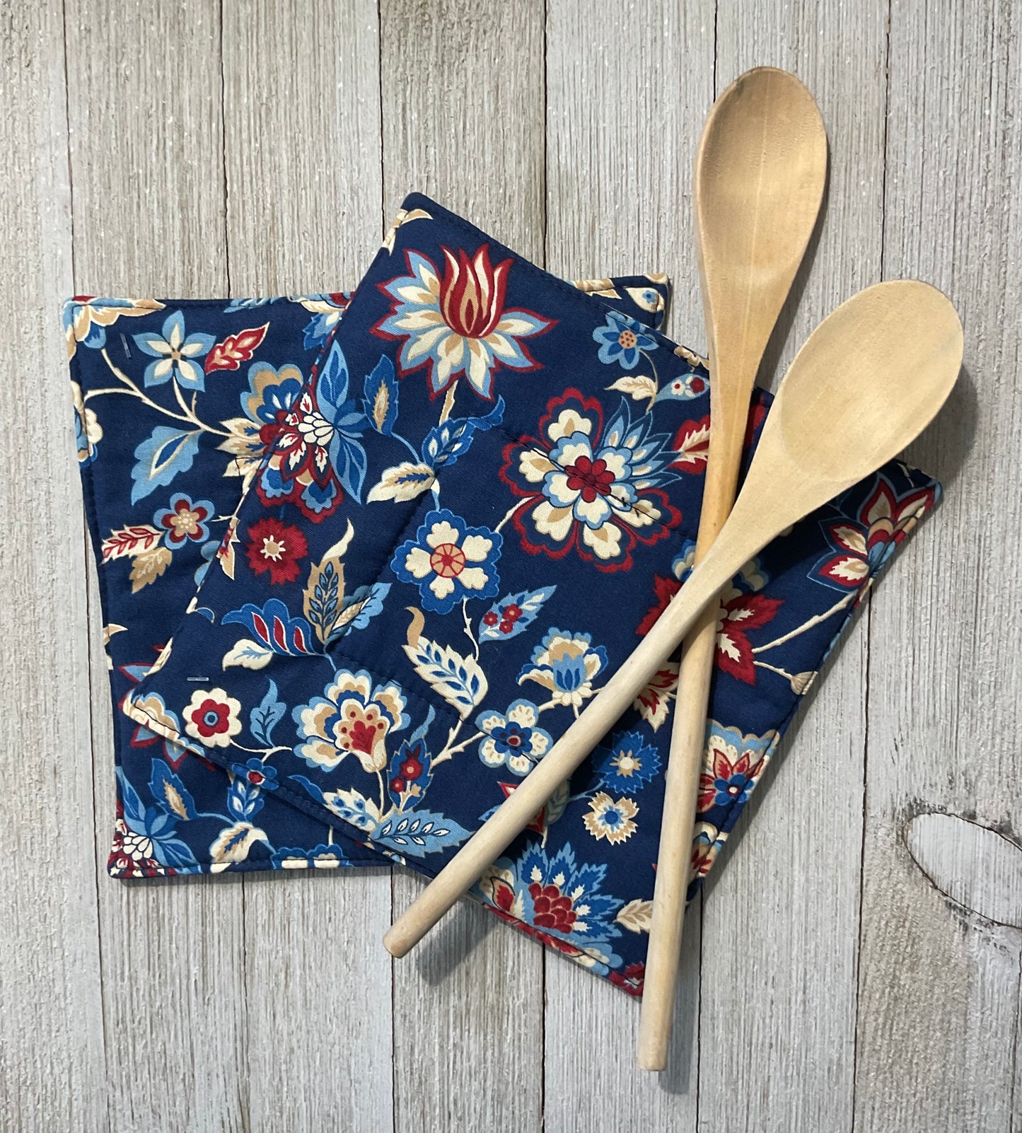 Earthy Red and Blue Potholder Hot Pad featuring a scrolling country floral vine 7.25” x7.25”