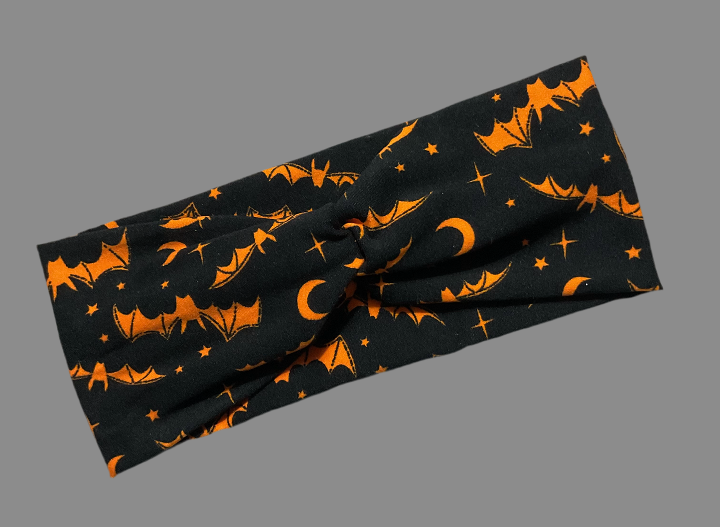 Wide twisted black with bright orange bats and moons fun way to celebrate the Halloween season wear for sports, yoga, workouts, soft, fashionable and comfortable