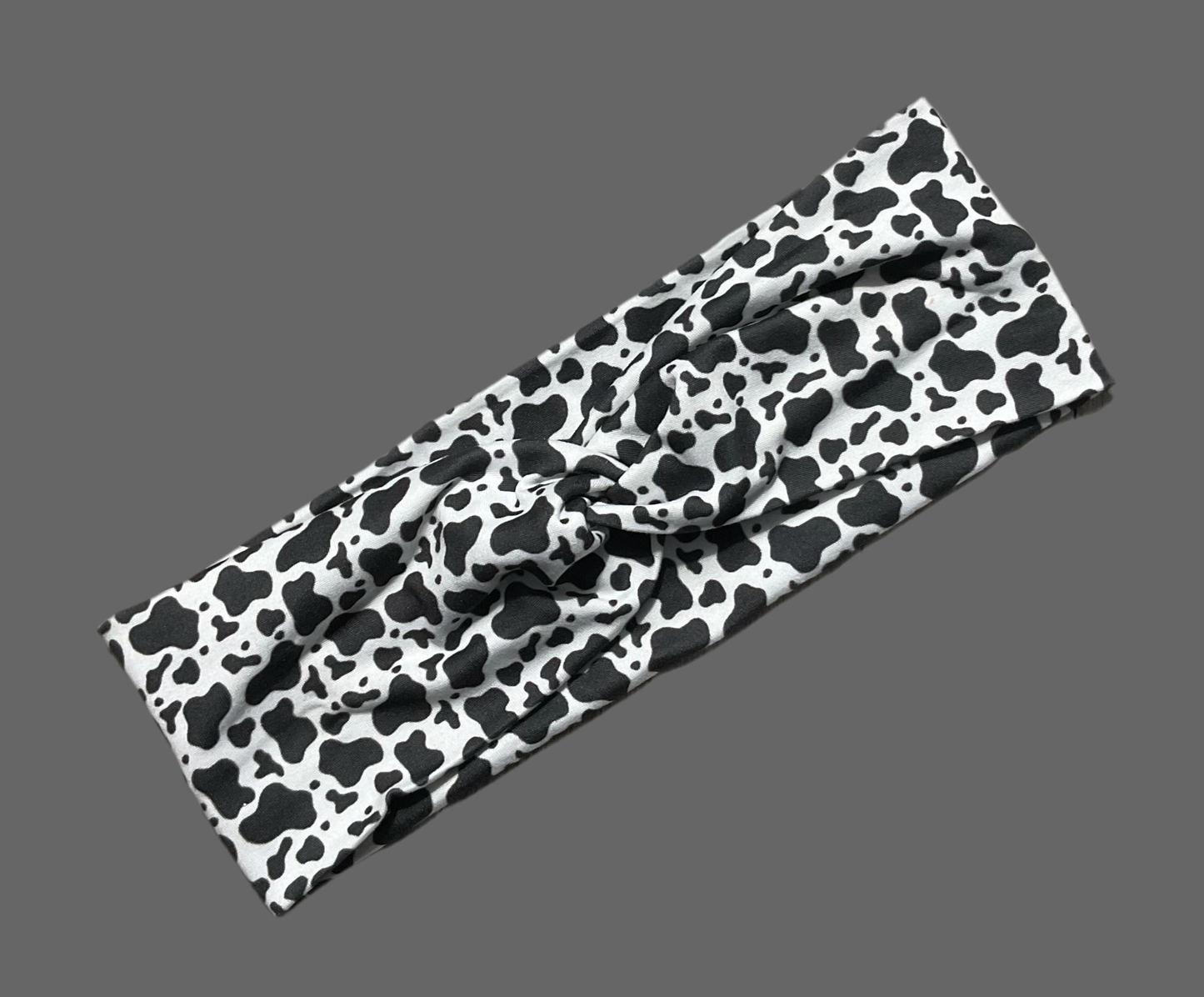 Wide twisted headband black and white cow print for sports, yoga, workouts, facials fashionable and comfortable