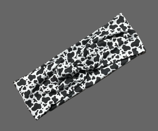 Wide twisted headband black and white cow print for sports, yoga, workouts, facials fashionable and comfortable