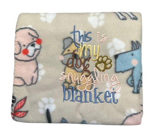 This is my Dog Snuggling Blanket with a puppy or paw print style lap blanket
