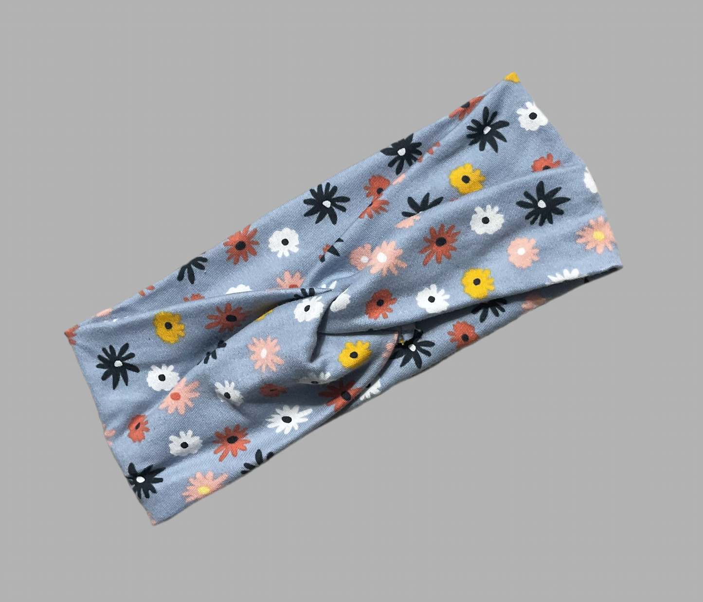 Wide twisted light blue with simple flowers headband for sports, yoga, workouts, facials fashionable and comfortable