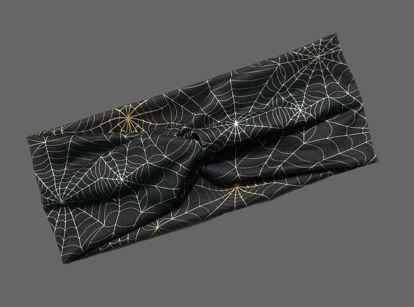 Wide twisted Halloween Spider Web headband perfect for the Halloween season, sports, yoga, workouts fun fashionable and comfortable