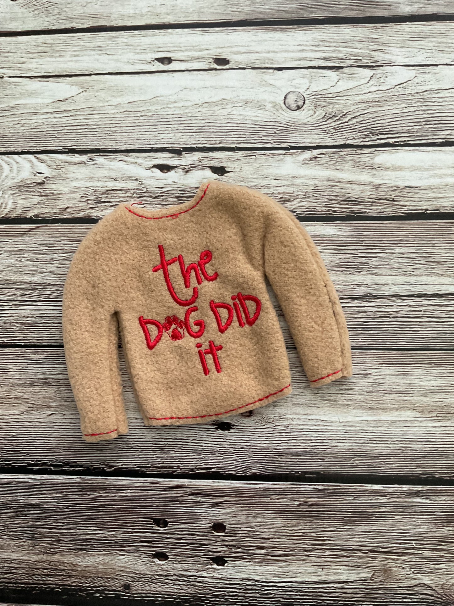 (124) Holiday Elf/Doll Sweater featuring a saying “The Dog Did It”