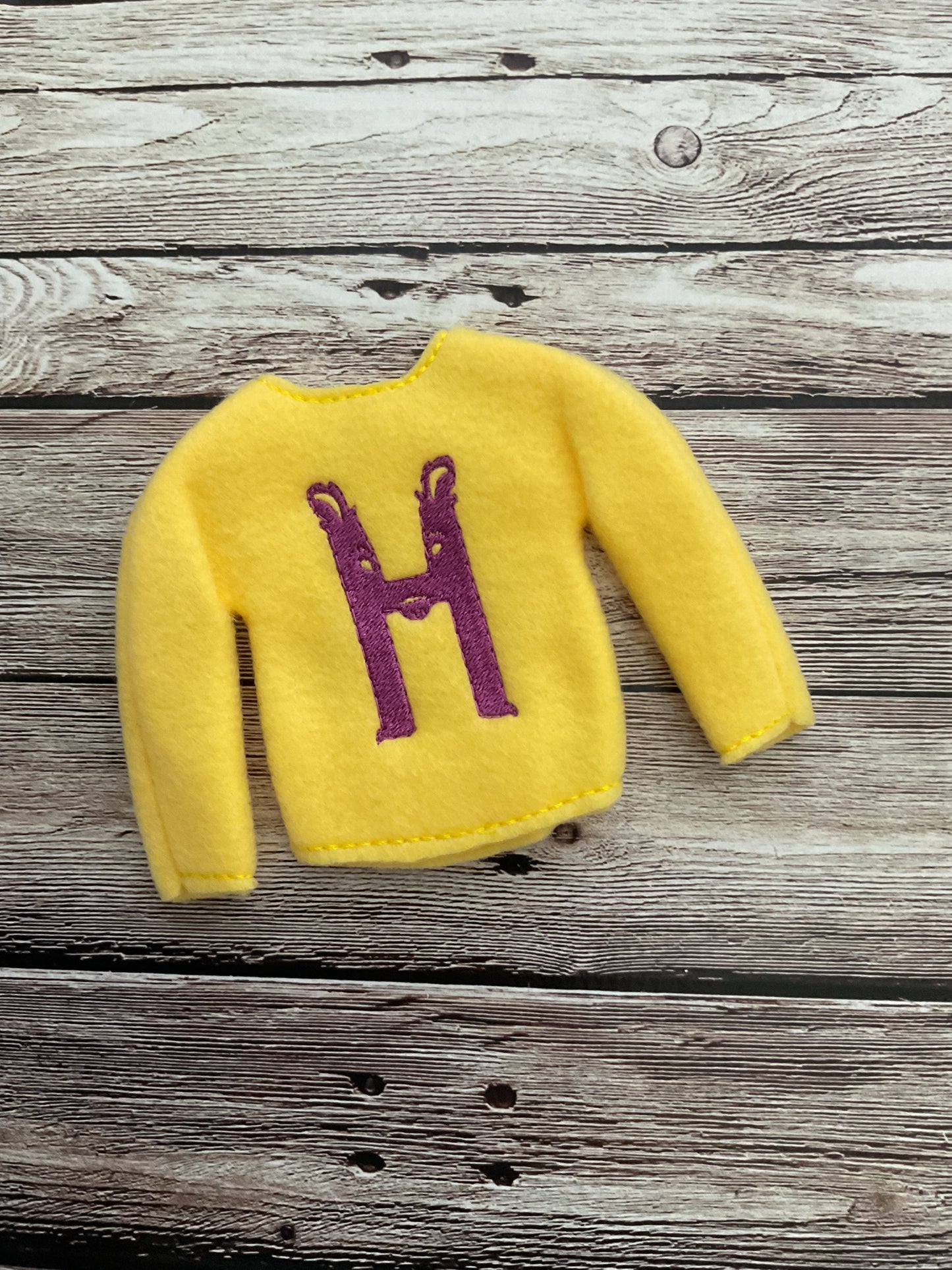 (113) Holiday Elf/Doll Sweater featuring a yellow Harry Potter H
