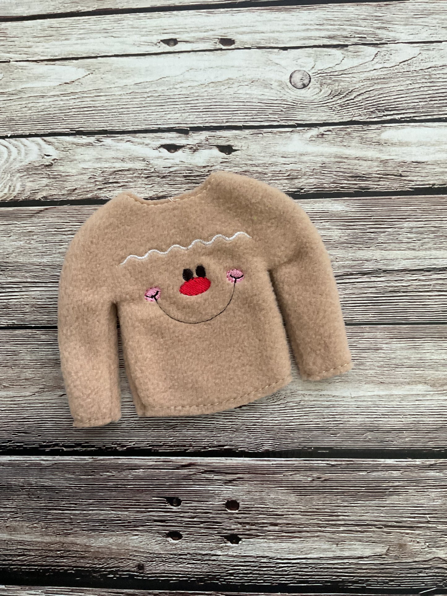 (116) Holiday Elf/Doll Sweater featuring a Gingerbread Man face
