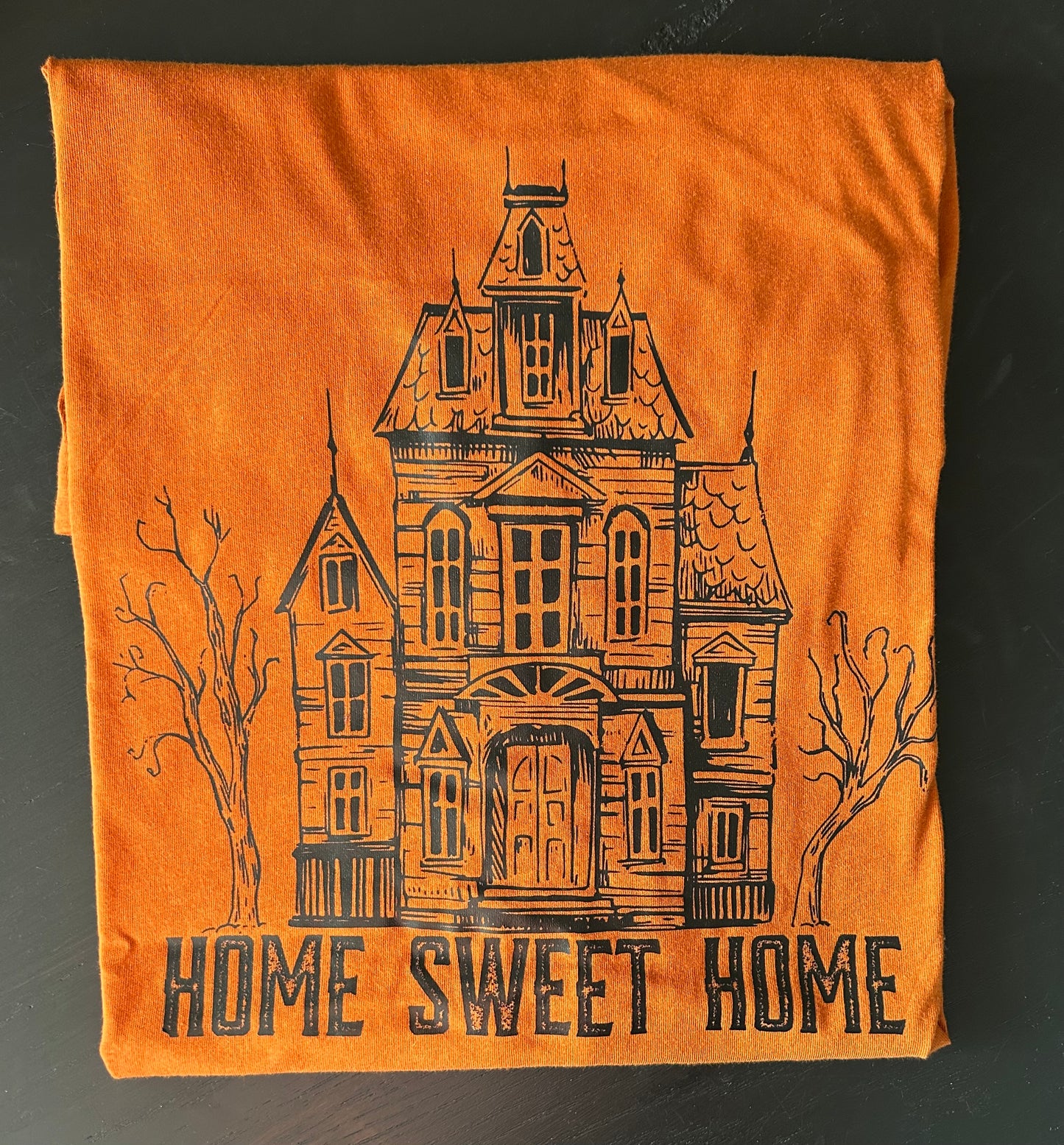 Home Sweet Home Graphic featuring a Spooky Haunted House - Orange