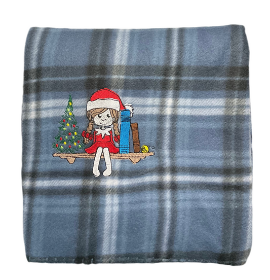 Girl Elf sitting on a Book Shelf with Christmas tree and Books Lap Blanket