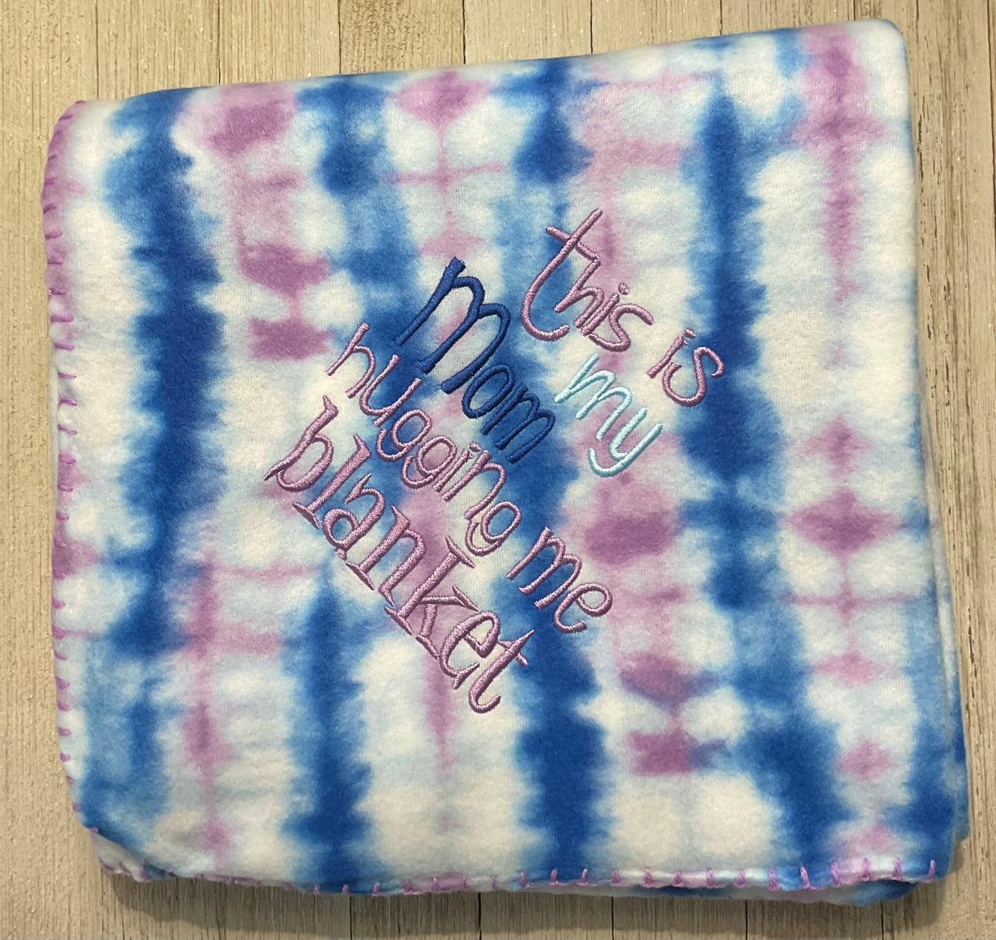 This is my Mom Giving me a Hug Blanket. Blue and purple tie dye Lap blanket