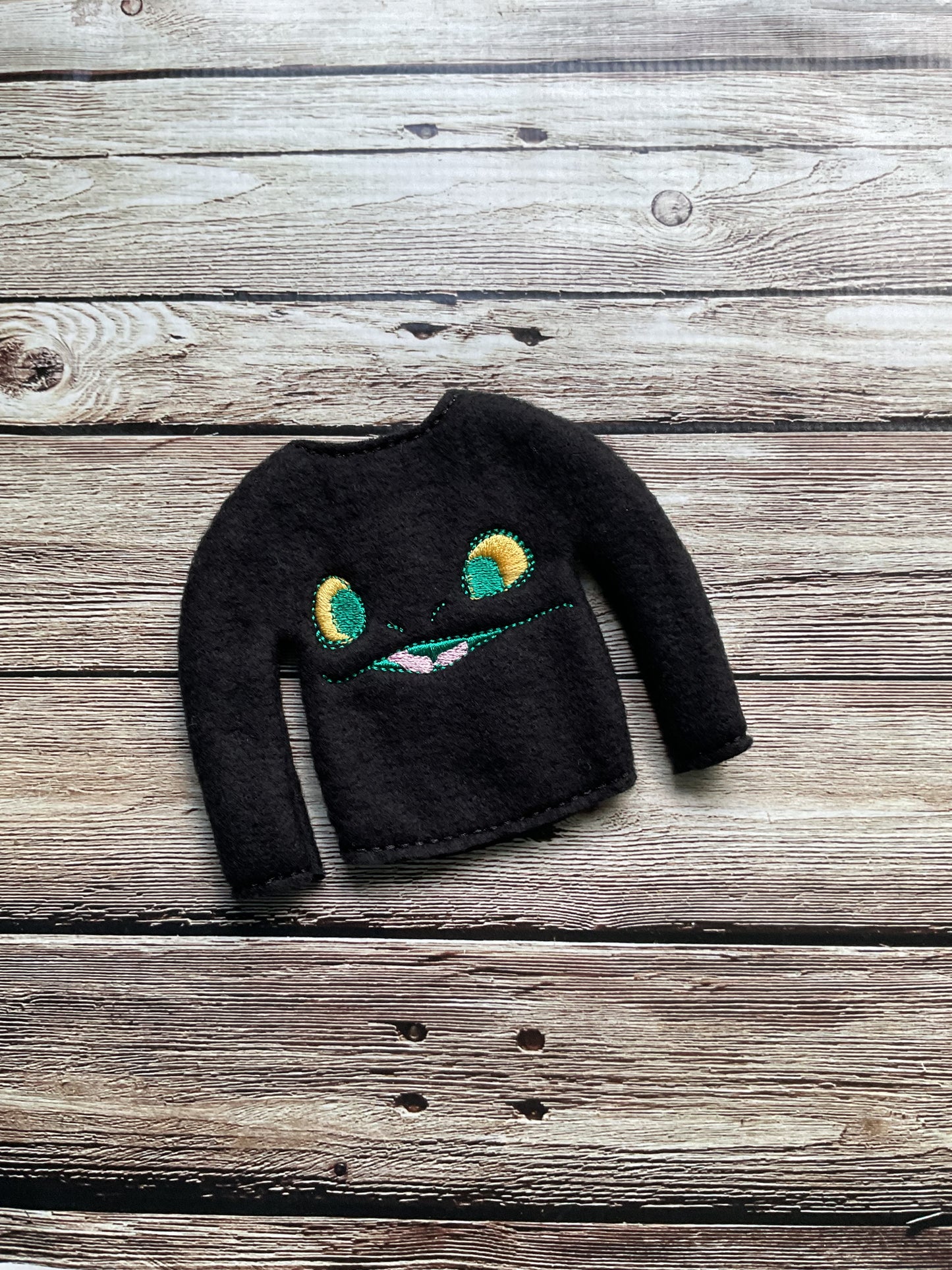 (144) Holiday Elf/Doll Sweater featuring a Dragon Black