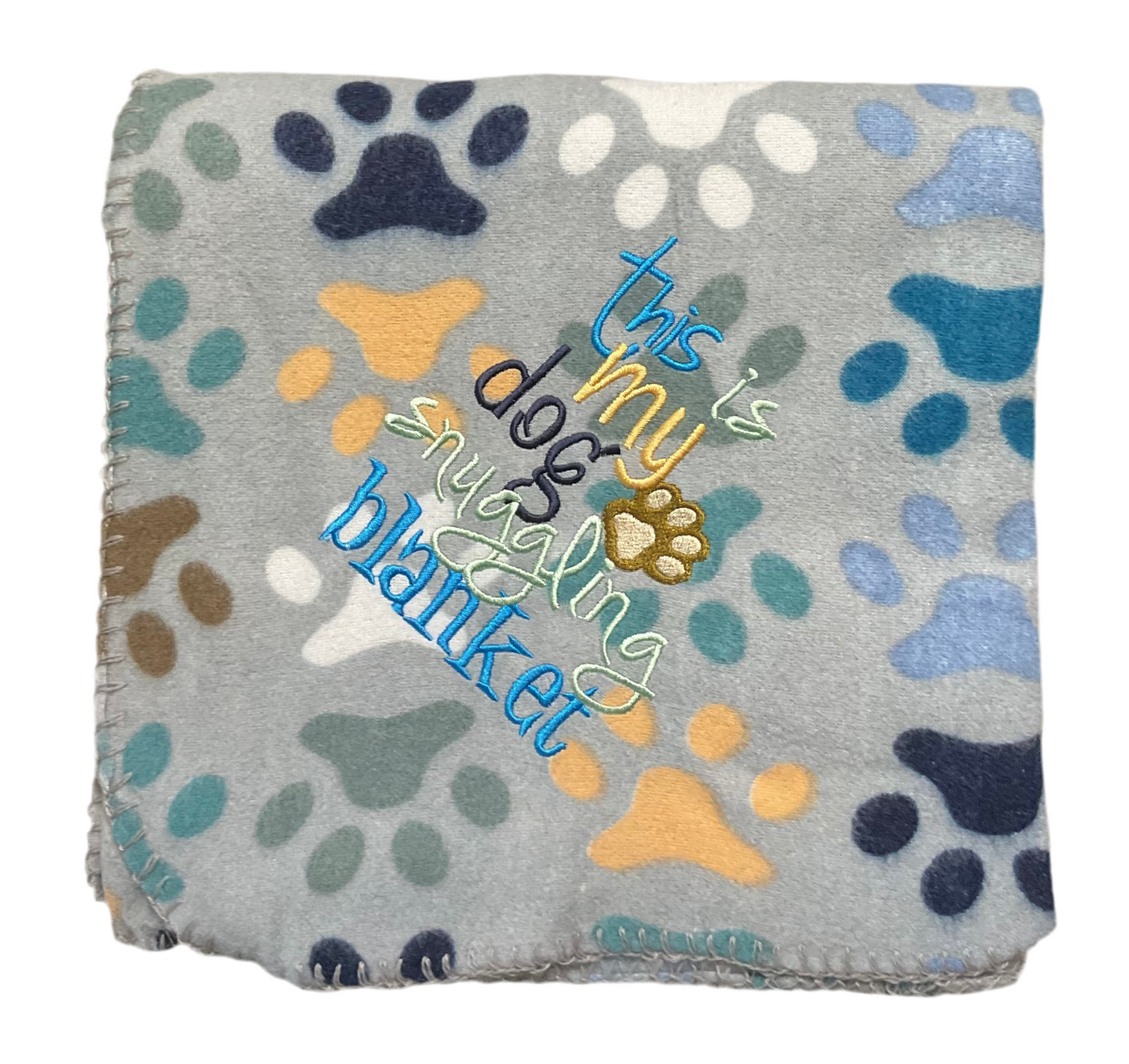 This is my Dog Snuggling Blanket with a puppy or paw print style lap blanket