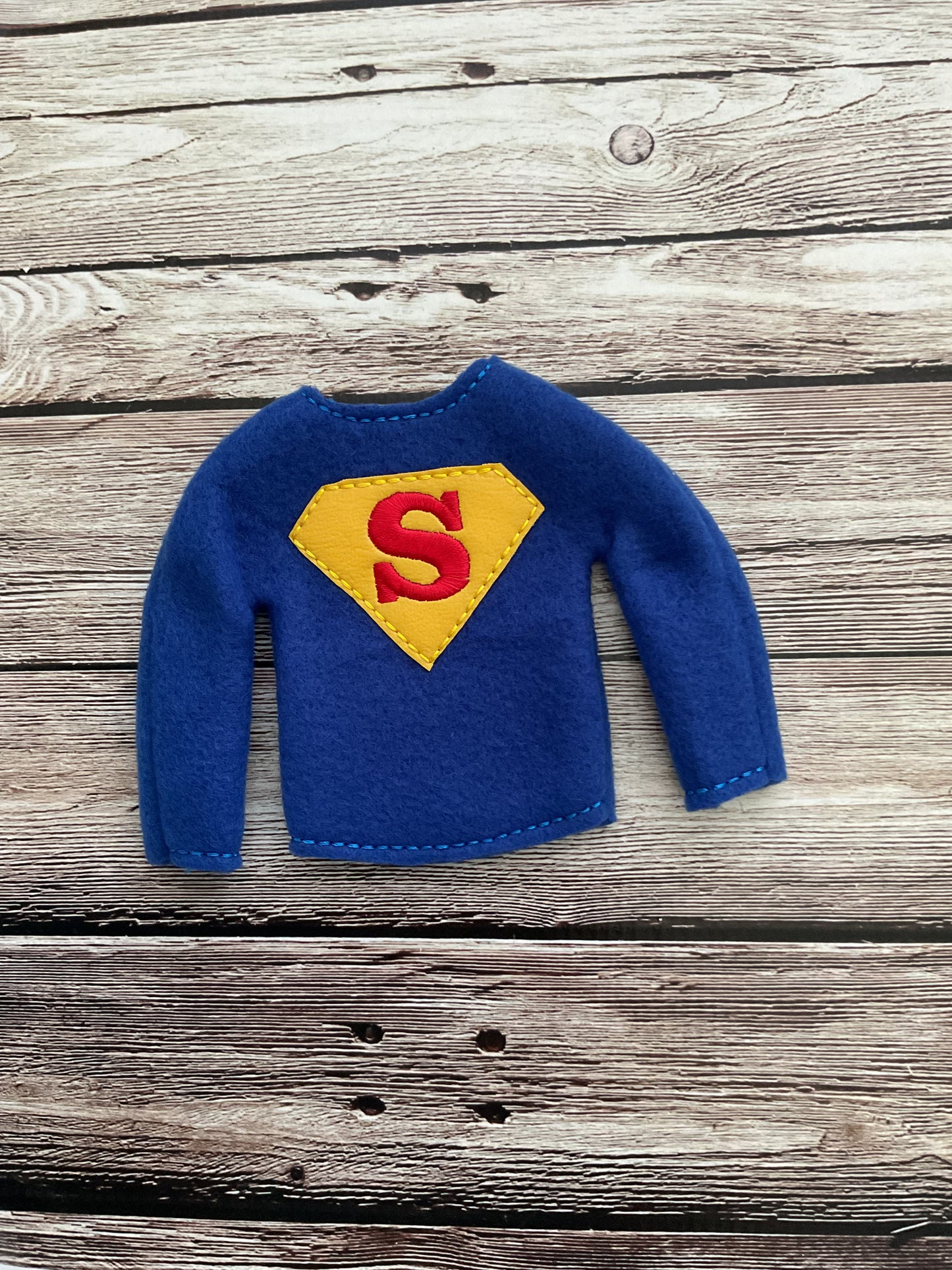 (115) Holiday Elf/Doll Sweater Featuring a Super Man Diamond S