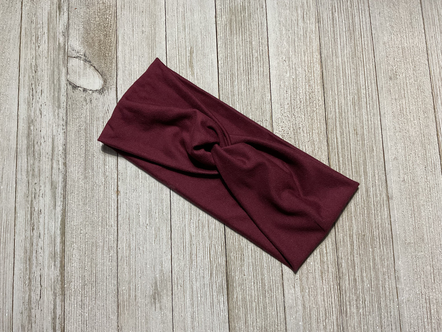 Wide twisted garnet headband. Great for sports, yoga, workouts, facials. It’s fashionable and comfortable