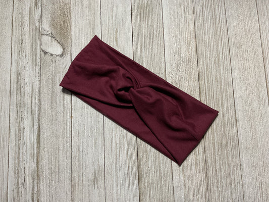 Wide twisted garnet headband.  Great for sports, yoga, workouts, facials. It’s fashionable and comfortable