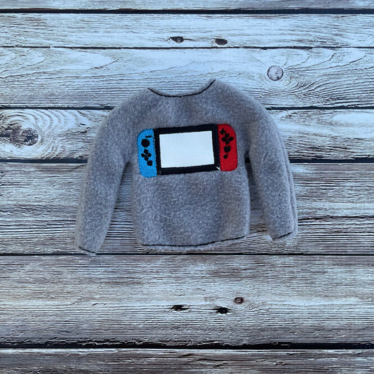 (239) Holiday Elf/Doll Sweater featuring a Game Switch