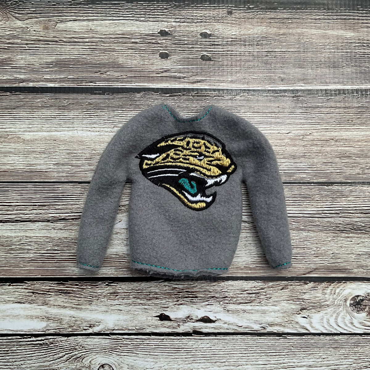 (303) Holiday Elf/Doll Sweater Jaguar Head