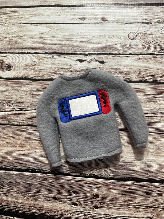 (239) Holiday Elf/Doll Sweater featuring a Game Switch