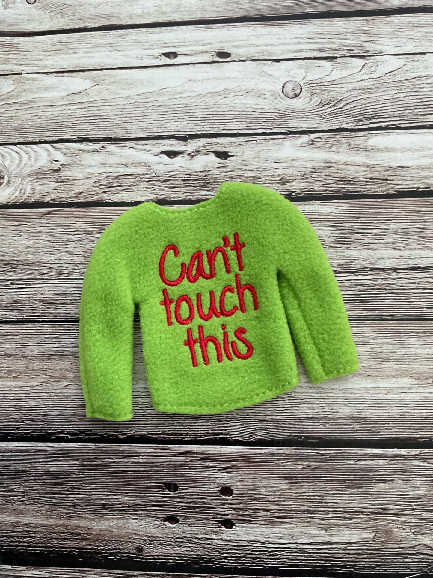 (118) Holiday Elf/Doll Sweater Featuring a fun saying “Can’t Touch This” Long Sleeve