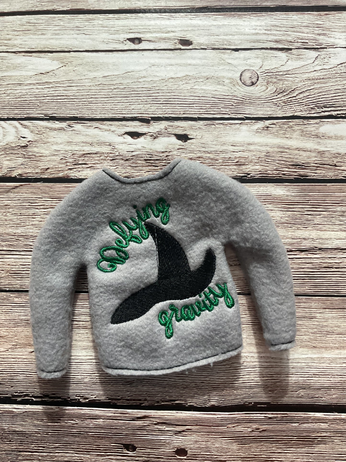 (266) Holiday Elf/Doll Sweater featuring a black Wicked Hat