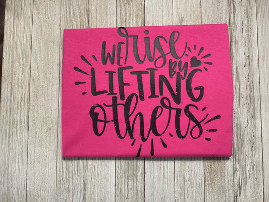 We Rise by Lifting Others Graphic T - Pink