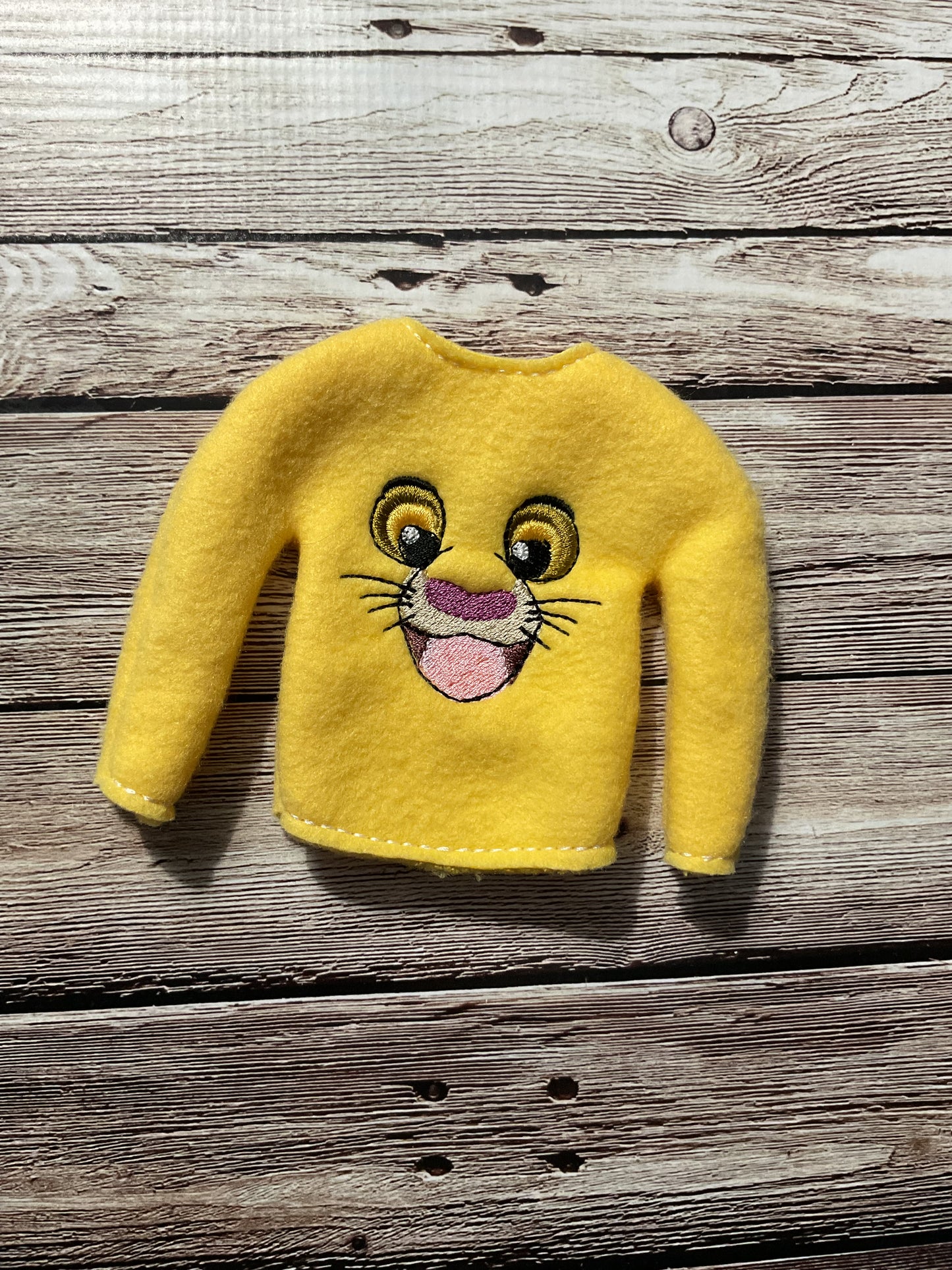 (142) Holiday Elf/Doll Sweater featuring a Lion face