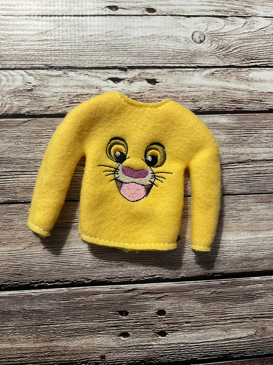 (142) Holiday Elf/Doll Sweater featuring a Lion face